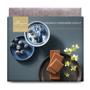 Gefüllte Vollmilchschokolade Confiserie Berger 100 g mit einer Creme aus Heidelbeeren und Gin, 35% Kakaoanteil.